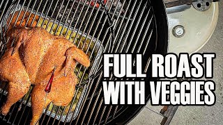 Full roast chicken in Weber kettle with roasted vegetables