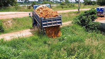 The first new project to add soil to the Into field to prevent flooding by Bulldozer MITSUBISHI mini