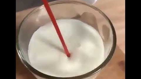 Drinking ketchup milk through a hot dog