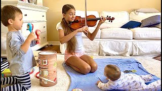 Kids playing classical music for baby brother