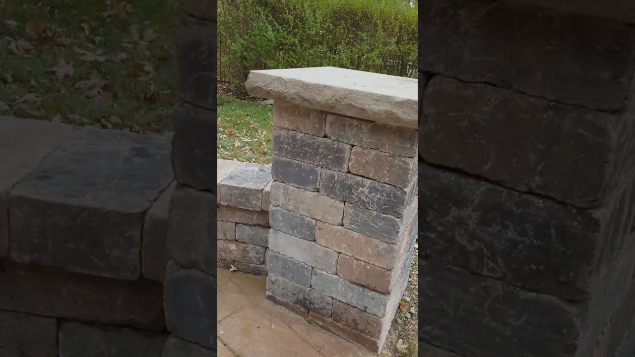 Stamped Concrete Patio with a Unilock Brussels Dimensional Seat Wall in Farmington Hills, MI