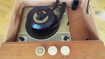 Magnavox Consolette automatic record player playing a few 45