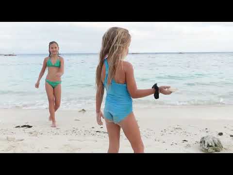 Children playing on the beach 4K