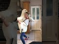 Woman ballroom dances around the kitchen with a standard poodle in her arms | CONTENTbible