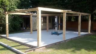 Three bay oak framed garage with doors.