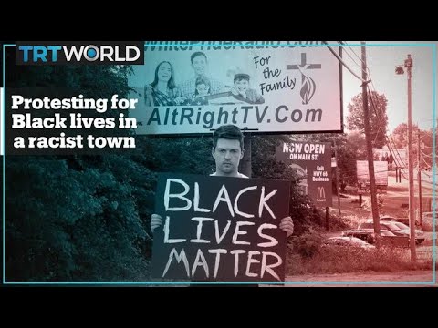 White man holds Black Lives Matter sign in America's most racist town