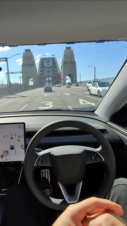 Tesla Model Y driving through Sydney’s Harbour Bridge — no hands needed. #Tesla #ModelY #Sydney