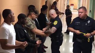 teens handcuffed and escorted to jail