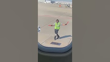 THIS AIRPORT WORKER IS DANCING IN FRONT OF A PLANE 😱😳🤣