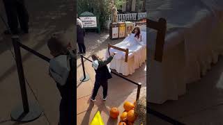 Girl Wearing a Costume in a Bed Playing Rock Paper Scissors with a Boy