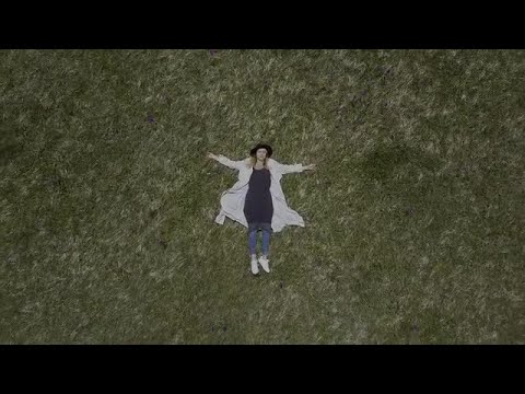 Woman Lying On The Grass Stock Video
