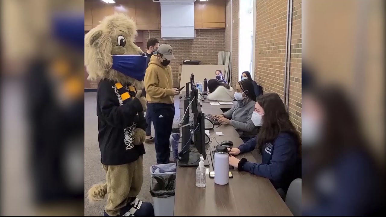 Our TCNJ Mascot, Roscoe the Lion, showing how to get Tested on Campus.
