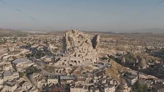 D-Log M. Uchisar, Nevsehir, Turkey. Morning aerial view of the majestic Uchisar Castle rock fortr...