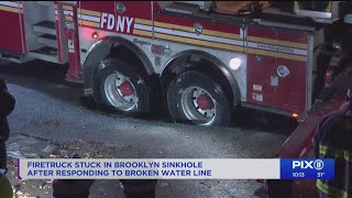 Firetruck stuck in Brooklyn sinkhole after responding to broken water line