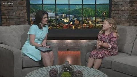 Junior anchor Haley Paul visits with Beth