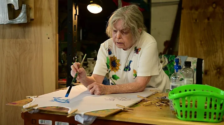 Artist Deborah Willard paints whimsical designs on...