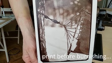 Burnishing albumen print from wet plate collodion negative.