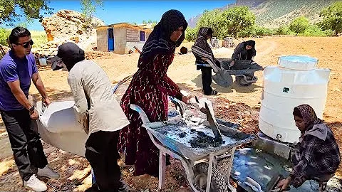 All together for one goal: helping Fariba to install a water tanker