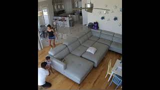 Little boy jumps on couch then falls over arm and lands in scorpion position (Security camera)