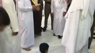 IMAM of Masjid Al Haram waits for a boy to finish salah to meet him