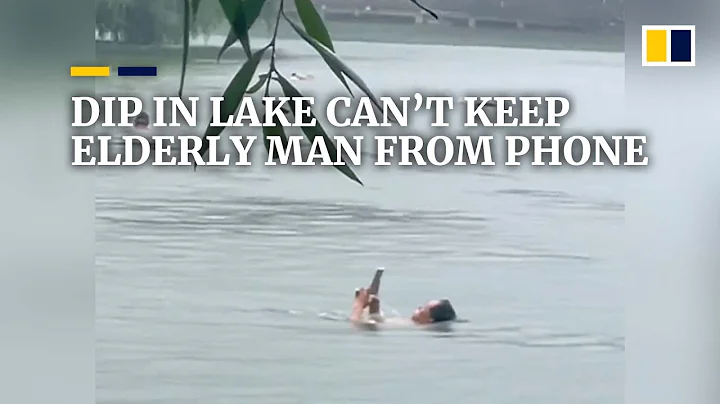 Luxurious dip in lake can’t keep elderly Chinese man from his phone - DayDayNews