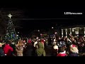 People sing deck the halls at the Fredericksburg tree lighting ceremony