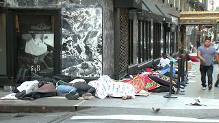 Line of migrants sleeping outside stretches around Roosevelt Hotel