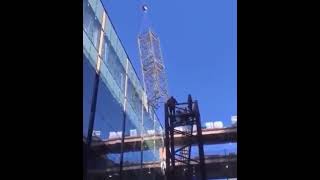 Crane Accidentally Destroys a Couple of Windows in a Glass Building