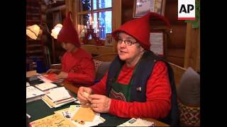 Santa Claus meets visiting children while he prepares for Christmas day.