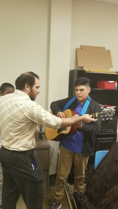 A little guitar lesson at the end of class.