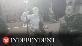 Reconstructed statue of emperor towers over Rome