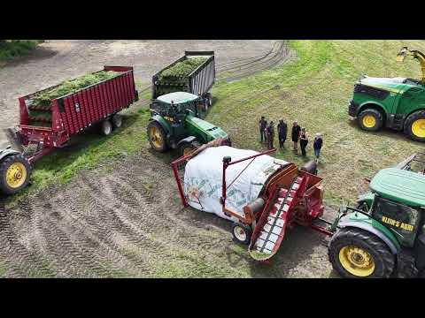 CANADIAN FARMER - AG-BAGGER RUNNING WIDE OPEN ! STUFFING A 250 FT. SILAGE BAG.
