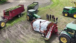 CANADIAN FARMER - AG-BAGGER RUNNING WIDE OPEN ! STUFFING A 250 FT. SILAGE BAG.