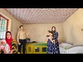 Ali installs the curtains, Parisa helps water the garden and cooks lunch.