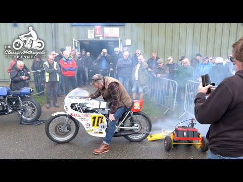 An eclectic group of classics bikes starting-up at a show