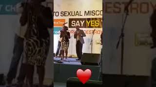 MWALiMU Ssozi Joram singing live with his wife en terrain podium™ stage®||Vocals©.