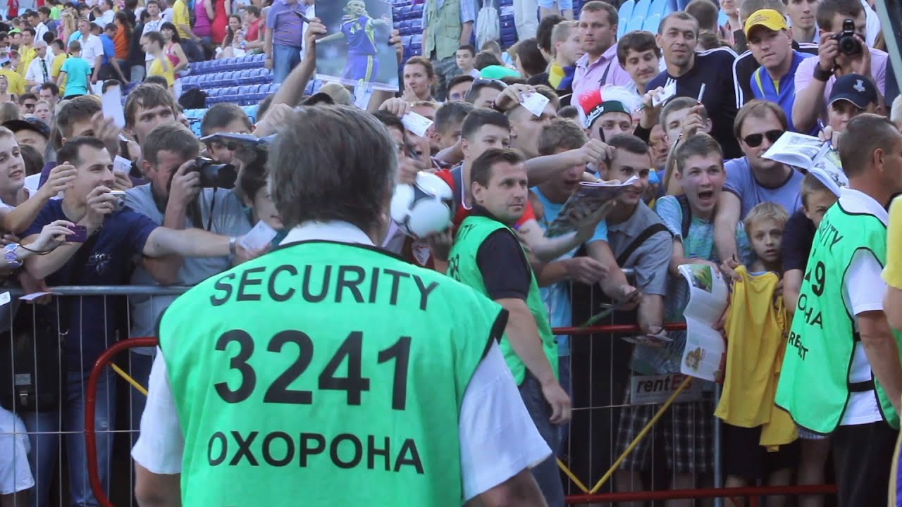 Security on a soccer match. Football steward secures fan zone from