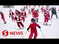 ‘Santa Claus’ take part in skiing and running events in US and Mexico