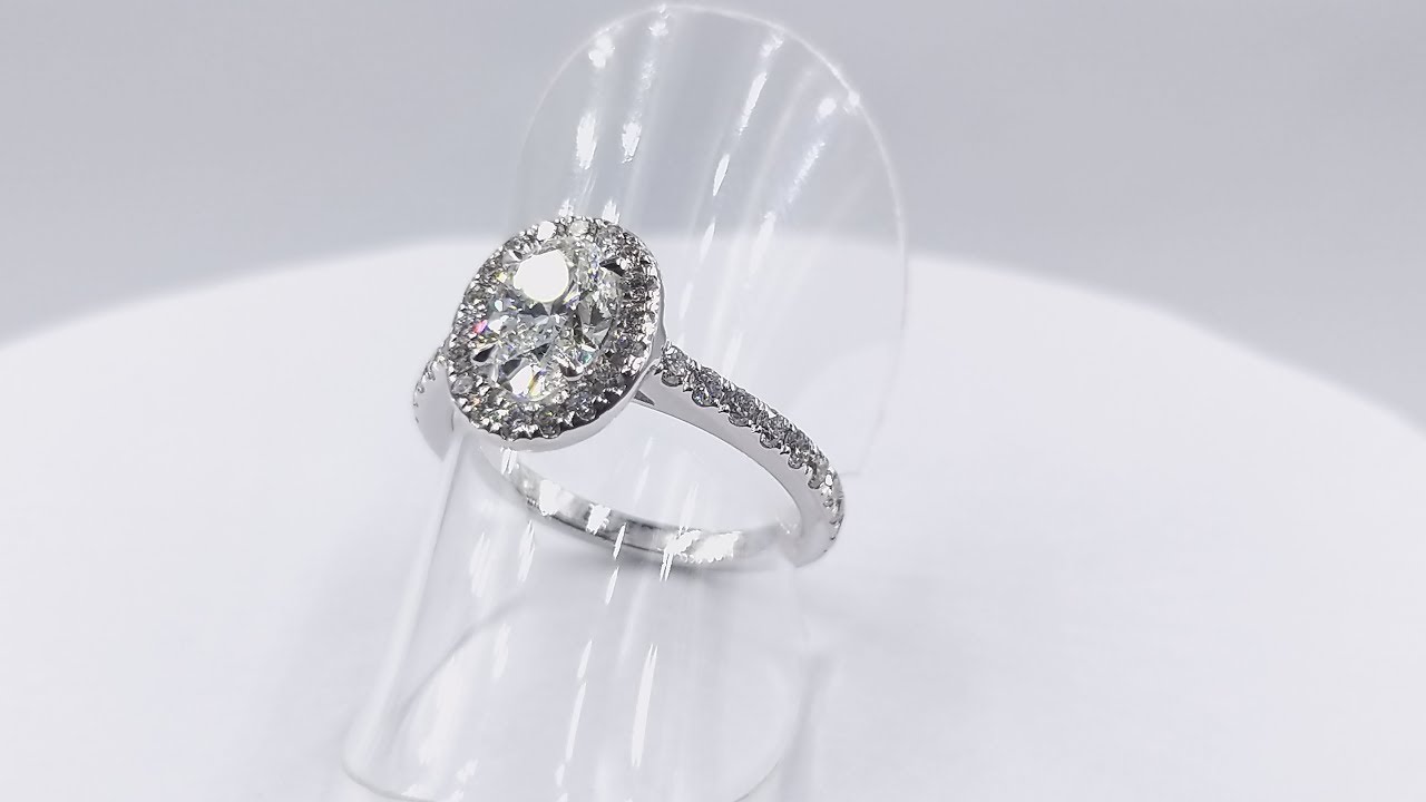 OVAL DIAMOND ENGAGEMENT RING WITH DIAMOND HALO & ACCENTED BAND BY GEMRIZE
