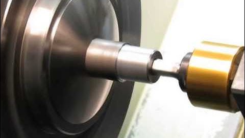 Rotary broaching.  Making a hex shaped hole on a lathe.