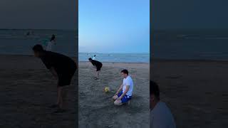 Man Backflips From Car Roof, Faceplants in Sand