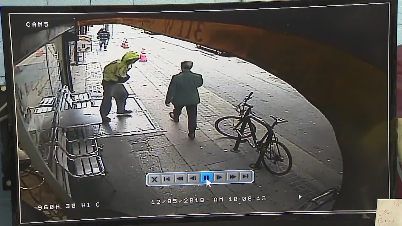 Homeless man pushes man in front of truck