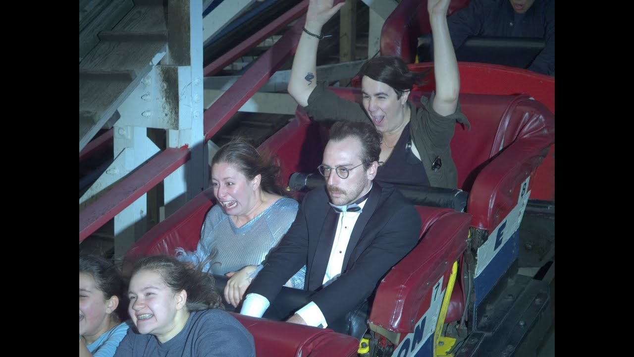 Weirdo rides coasters at Coney Island in a Tuxedo!