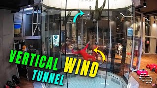 Two Skydivers Flying in a Vertical Wind Tunnel