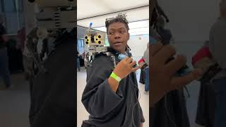 Odd Jayy shows off his Frr robot and Magpie goggles at Hackaday Supercon 2022