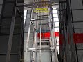Vertical Conveyor System in Operation | Customized Material Handling Solution