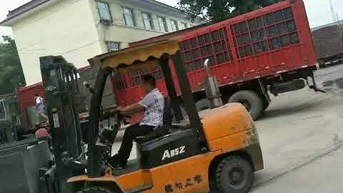 Forklift driver is loading plastic brick pallets