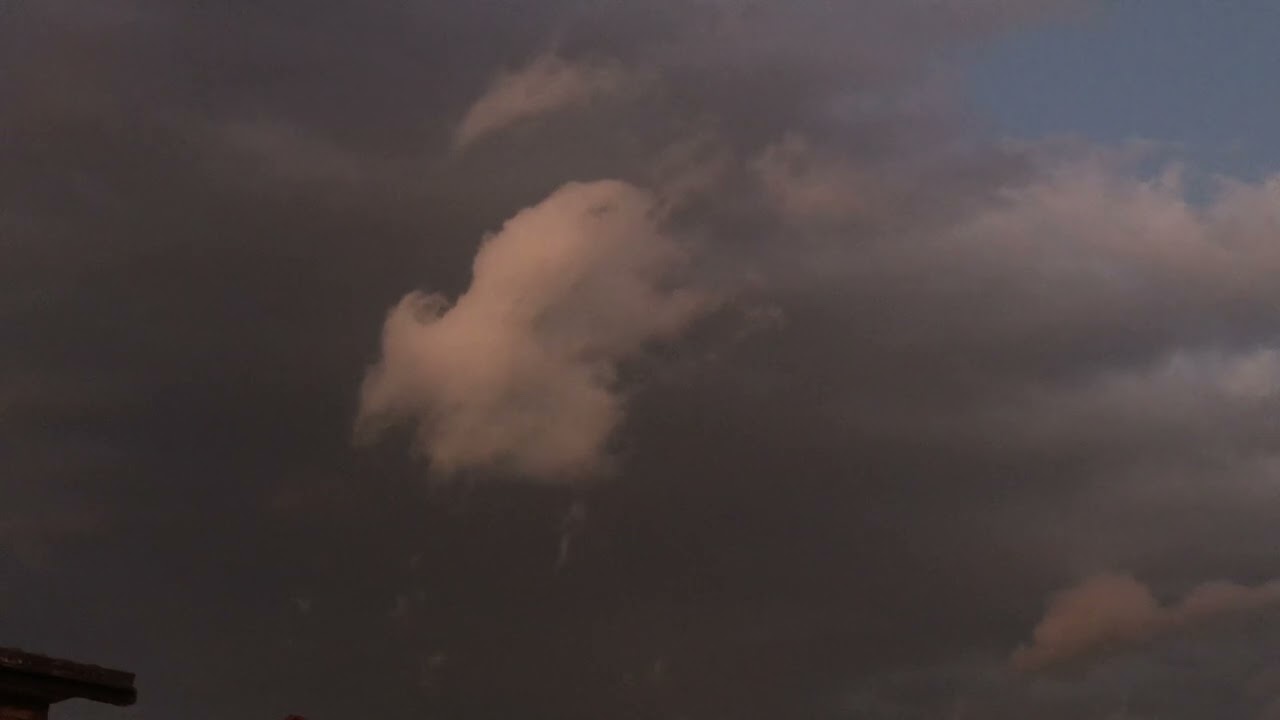 Two opposite rotating scud clouds collide 