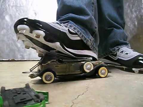 Plastic Model Car Crushed with Nike Metal Spike Cleats
