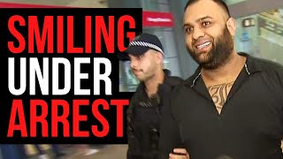 Accused crime boss all smiles under arrest 😁